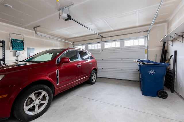 garage featuring a garage door opener