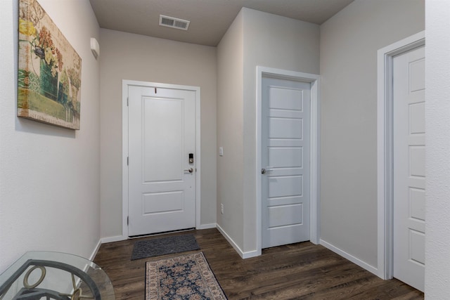 doorway to outside featuring dark hardwood / wood-style flooring