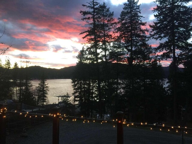 12507 N Cherokee Dr, Newman Lake, WA 99025 - wooden deck featuring a water and mountain view