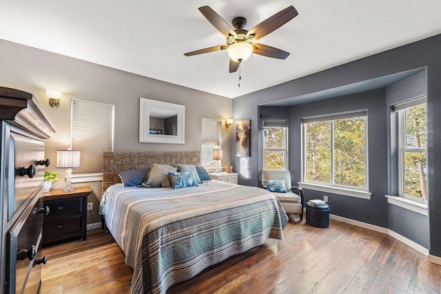 12507 N Cherokee Dr, Newman Lake, WA 99025 - bedroom featuring light wood finished floors, baseboards, and a ceiling fan