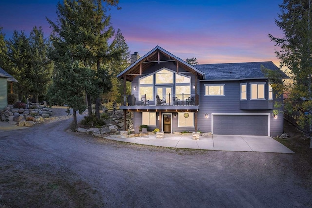 12507 N Cherokee Dr, Newman Lake, WA 99025 - view of front facade featuring driveway, a garage, and a chimney