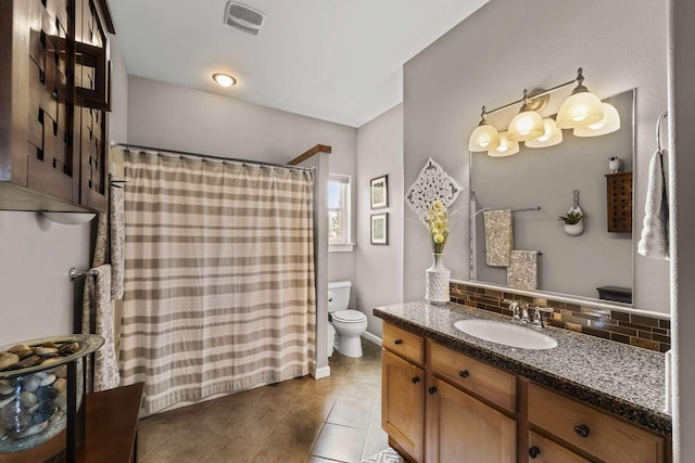 12507 N Cherokee Dr, Newman Lake, WA 99025 - bathroom with backsplash, toilet, tile patterned flooring, vanity, and a shower with curtain