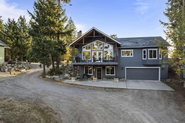 12507 N Cherokee Dr, Newman Lake, WA 99025 - view of front of property featuring concrete driveway, an attached garage, and a chimney