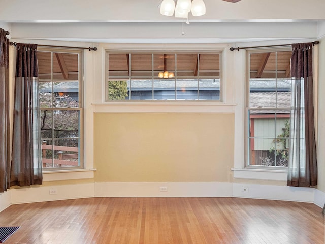 spare room featuring ceiling fan and hardwood / wood-style flooring