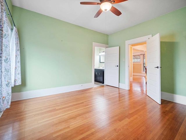 interior space with ceiling fan and light hardwood / wood-style floors