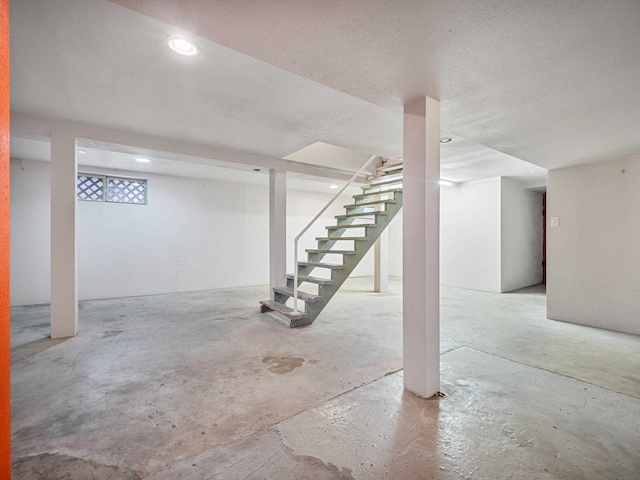 basement with a textured ceiling