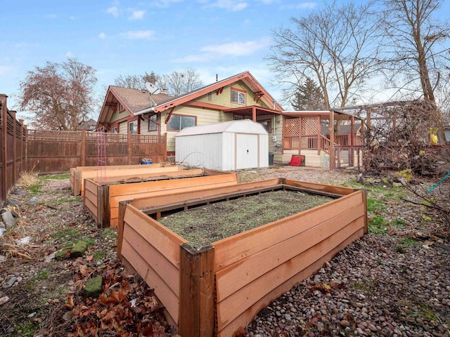 exterior space featuring a storage shed and a deck