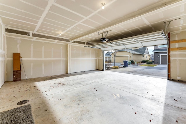 garage featuring a carport and a garage door opener