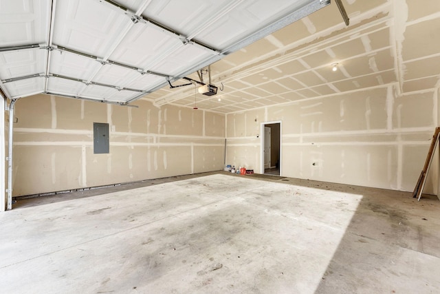 garage with electric panel and a garage door opener