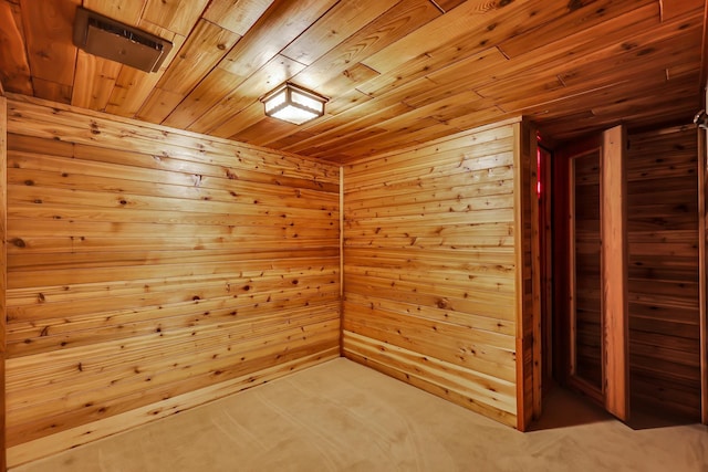 empty room with wood walls and wood ceiling