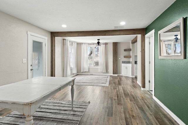 hallway featuring dark wood-type flooring