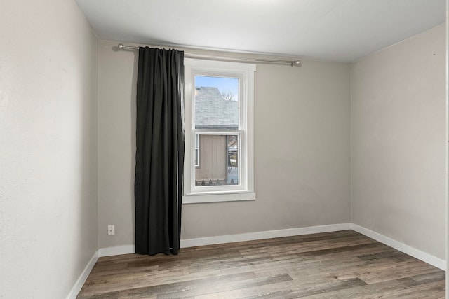 empty room featuring wood-type flooring