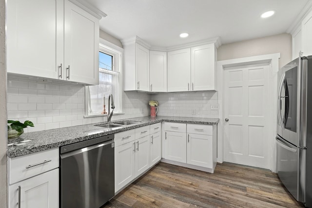 kitchen featuring sink, white cabinets, stainless steel appliances, and dark hardwood / wood-style floors