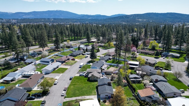 bird's eye view with a residential view, a forest view, and a mountain view