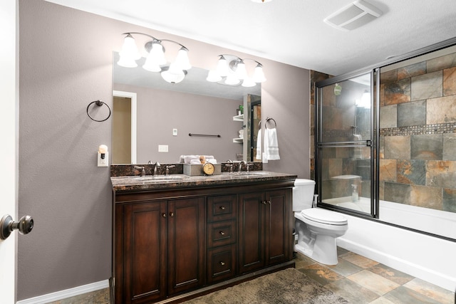 full bathroom with shower / bath combination with glass door, vanity, and toilet