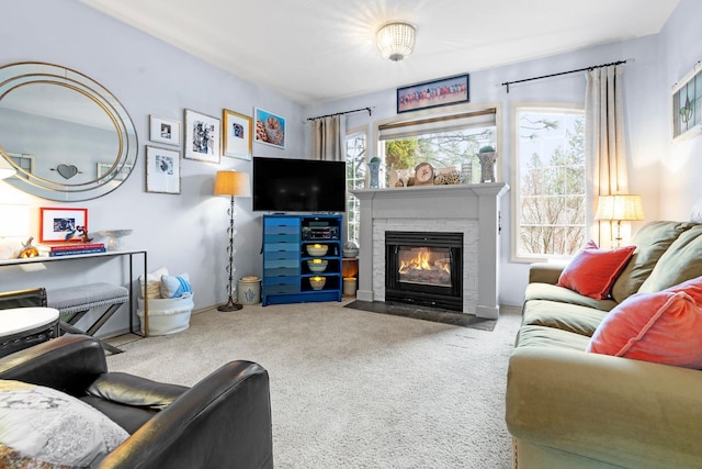 carpeted living room with a fireplace