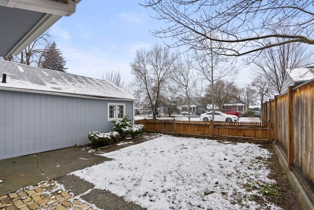 view of yard layered in snow