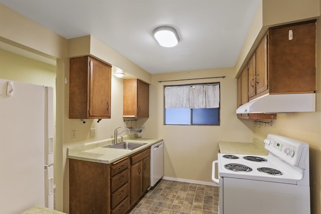 kitchen with sink and white appliances