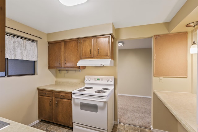 kitchen featuring white electric range, carpet floors, and pendant lighting