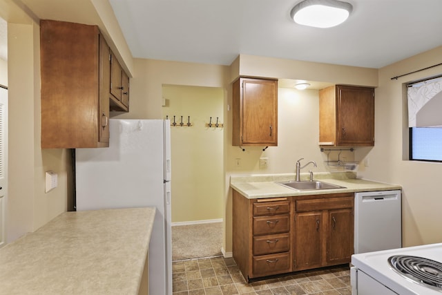 kitchen featuring sink and white appliances