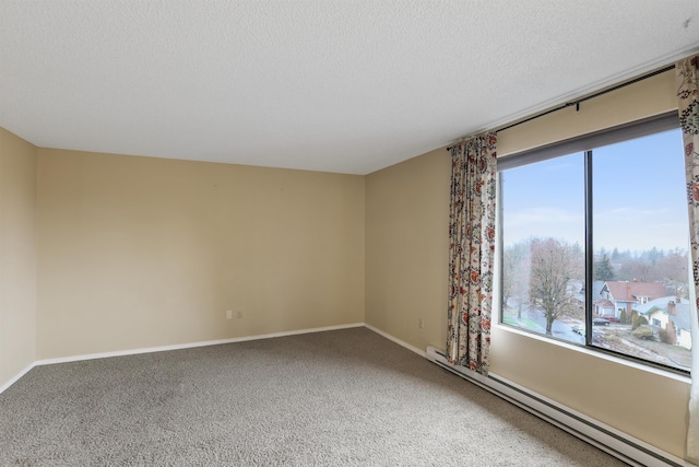 carpeted spare room featuring baseboard heating and a textured ceiling