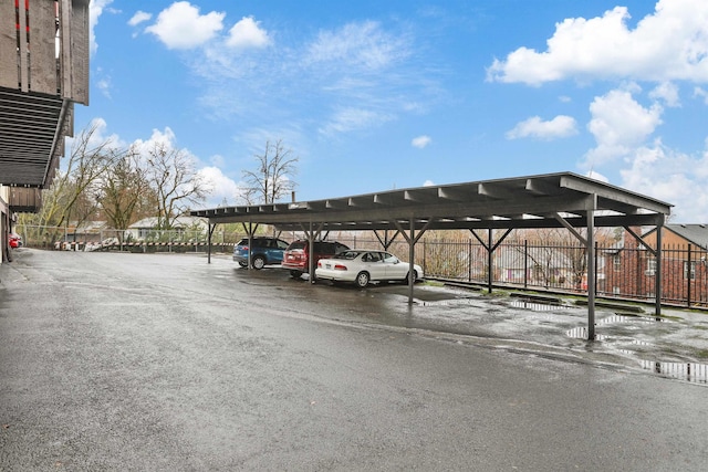 view of vehicle parking featuring a carport