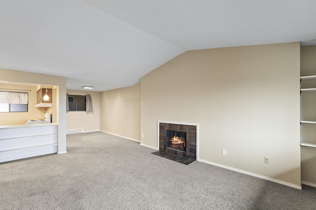 unfurnished living room featuring carpet flooring, a fireplace, and lofted ceiling