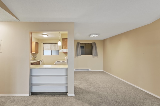 interior space with light carpet, separate washer and dryer, baseboard heating, and hanging light fixtures