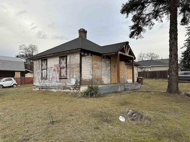2803 N Hamilton St, Spokane, WA 99207 - view of side of property featuring a chimney and roof with shingles