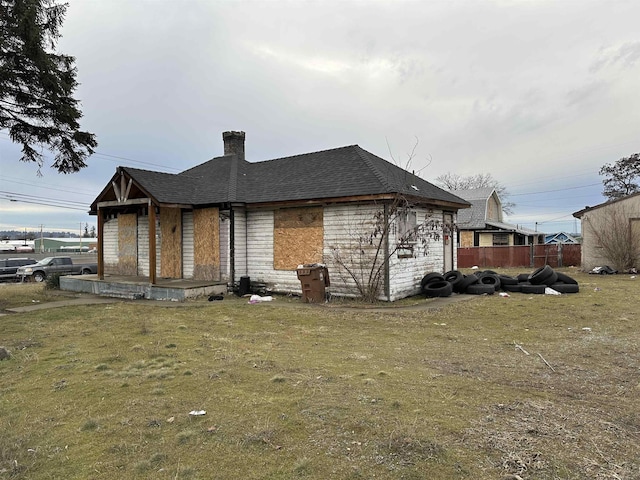 exterior space featuring a lawn and a porch