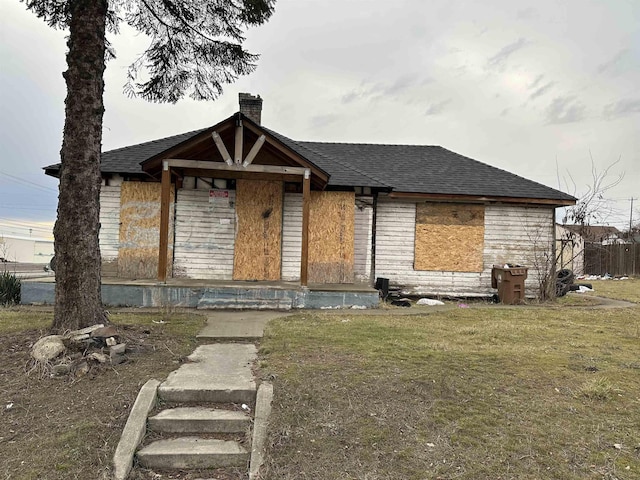 2803 N Hamilton St, Spokane, WA 99207 - view of front of home featuring a chimney, a shingled roof, and a front lawn