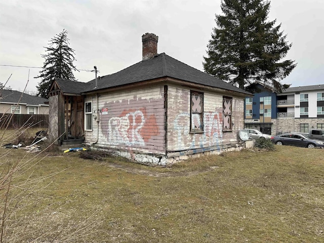 view of home's exterior with a lawn