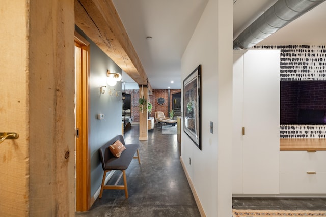 hallway with brick wall