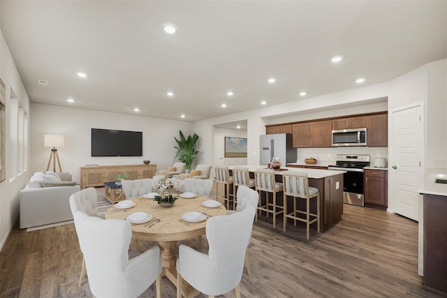 dining space featuring dark wood-type flooring