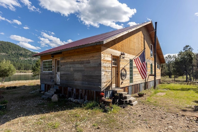 view of side of home featuring a mountain view