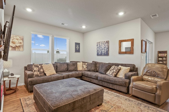 living room with light hardwood / wood-style floors