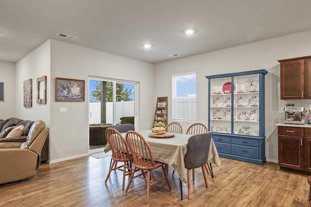 dining space featuring light wood-type flooring