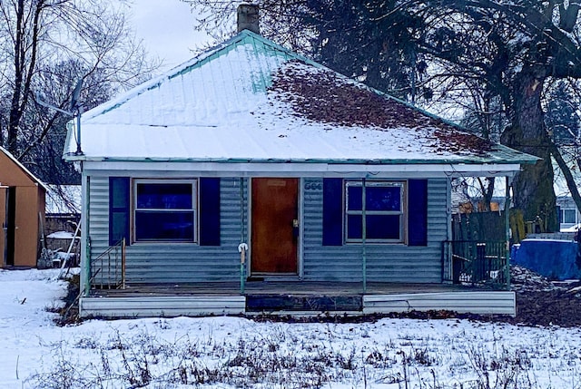 530 Kalmia St, Kettle Falls, WA 99141 - bungalow-style home with a porch and a chimney