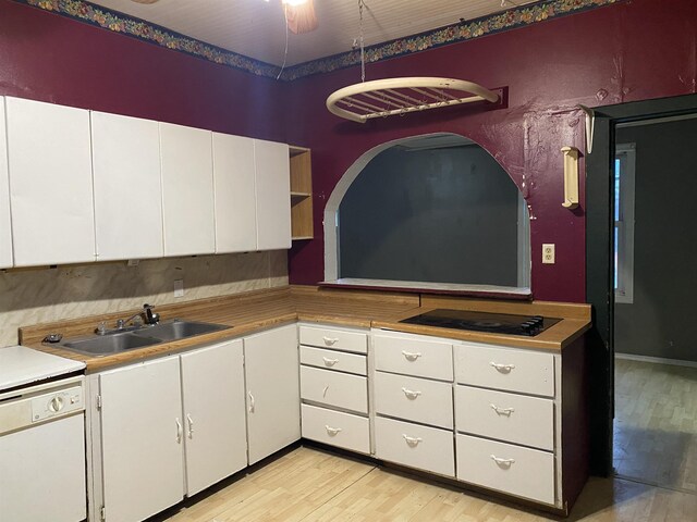 kitchen with washer / clothes dryer, light hardwood / wood-style flooring, ceiling fan, and stainless steel oven