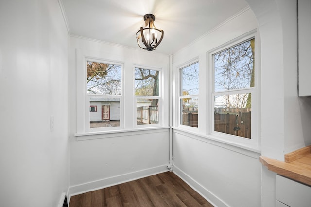 unfurnished sunroom featuring an inviting chandelier