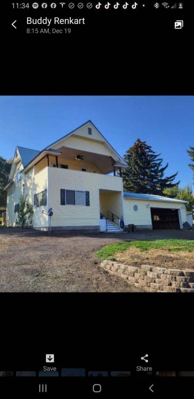 view of front of house with ceiling fan