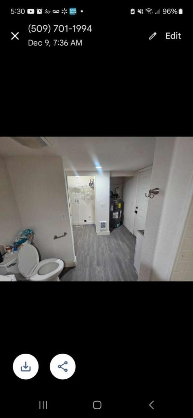 bathroom with hardwood / wood-style flooring