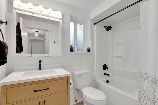 full bathroom featuring vanity, shower / bath combination, and toilet