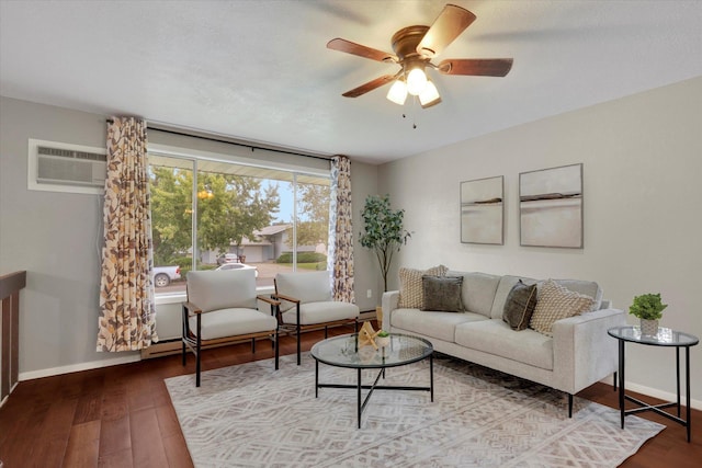 living room with hardwood / wood-style floors, a wall unit AC, and ceiling fan