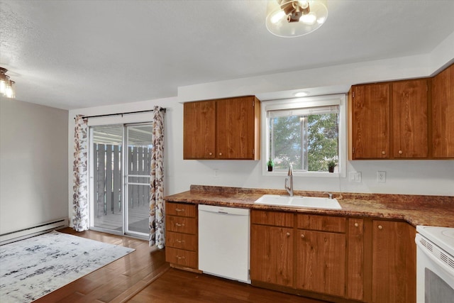 kitchen with dishwasher, sink, dark hardwood / wood-style floors, a textured ceiling, and a baseboard radiator