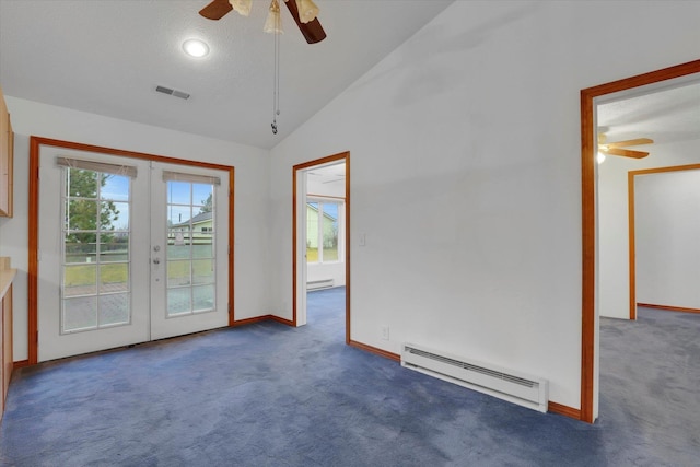 carpeted spare room with french doors, a textured ceiling, vaulted ceiling, baseboard heating, and ceiling fan