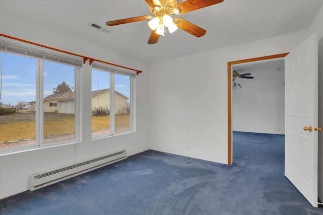 carpeted spare room with baseboard heating and ceiling fan