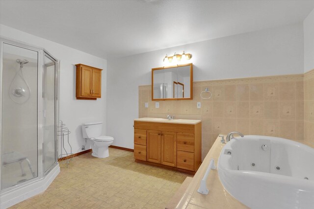 full bathroom with vanity, independent shower and bath, and toilet