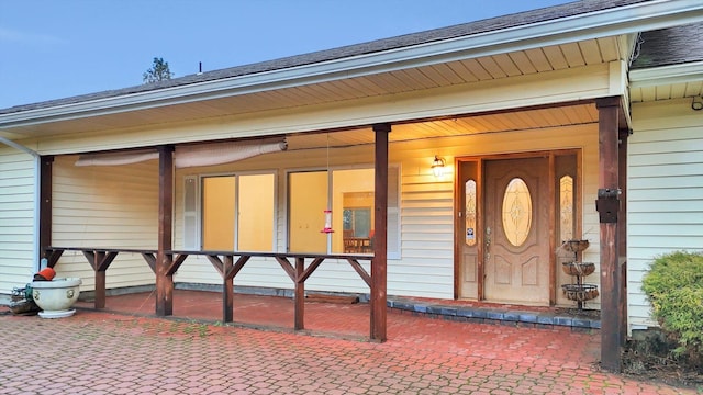 doorway to property with covered porch