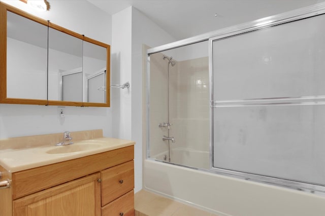 bathroom with tile patterned flooring, vanity, and shower / bath combination with glass door